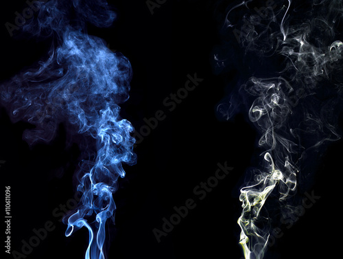 blue and white smoke the black background