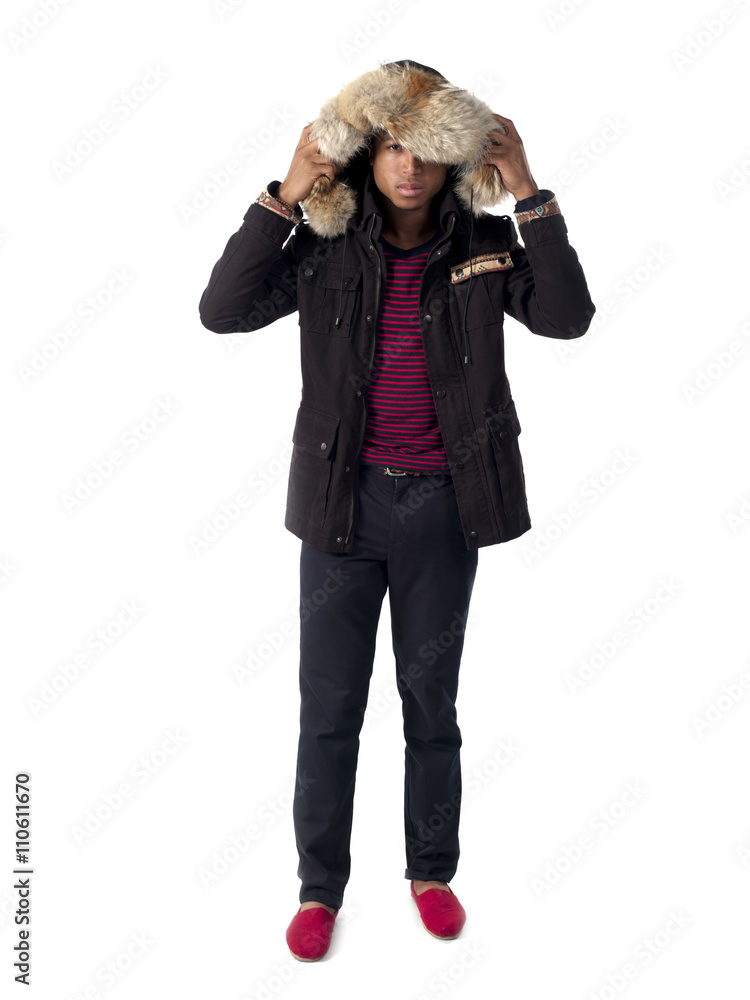 view of a teenage boy standing in hood.