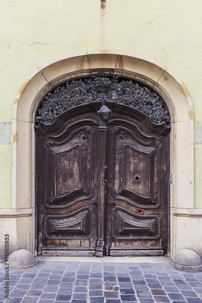 Ancient door in one of the buildings of Budapest