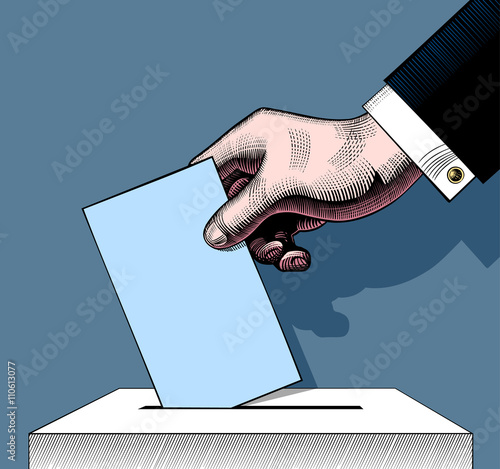 Hand putting voting paper in the ballot box