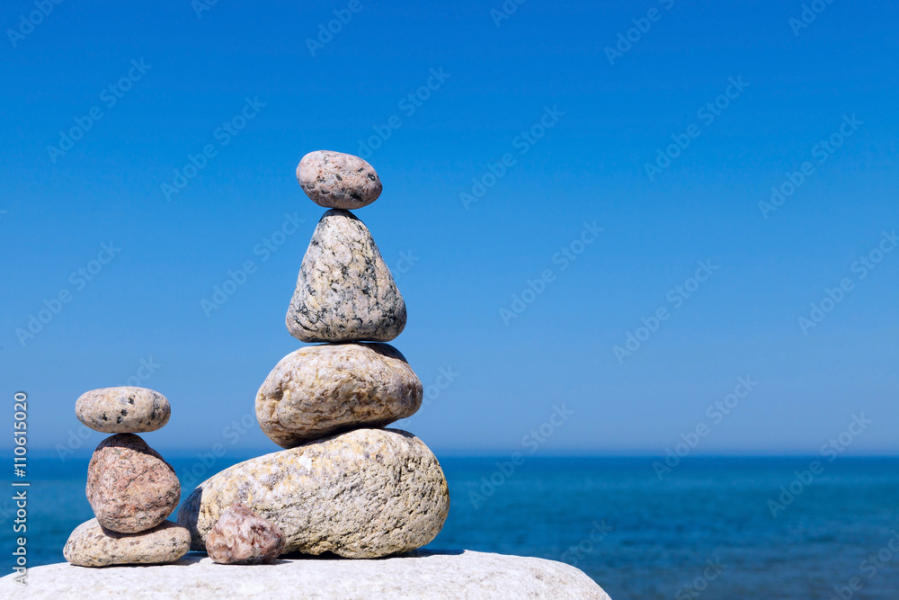 Concept of harmony and balance. Rock Zen on the background of su