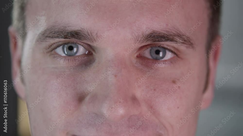 Close up on the face of smiling young man Close up on the face of smiling young man