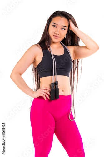 Young asian woman in sportswear posing
