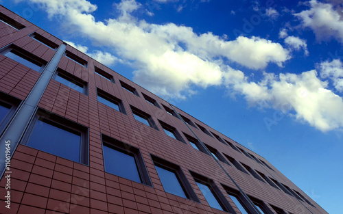 Red Brick Building with Windows and Sky