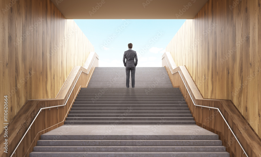 Businessman climbing stairs