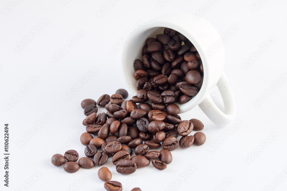 Coffee beans in coffee cup white background Coffee beans in coffee cup white background