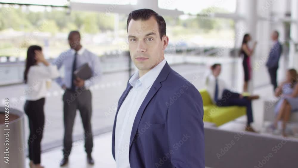 Portrait of confident serious businessman in modern office building Portrait of confident serious businessman in modern office building