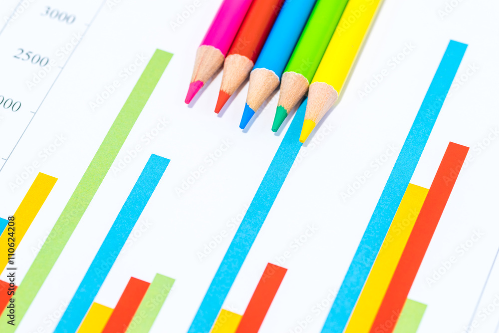 Colorful business charts and wooden pencils Colorful business charts and wooden pencils