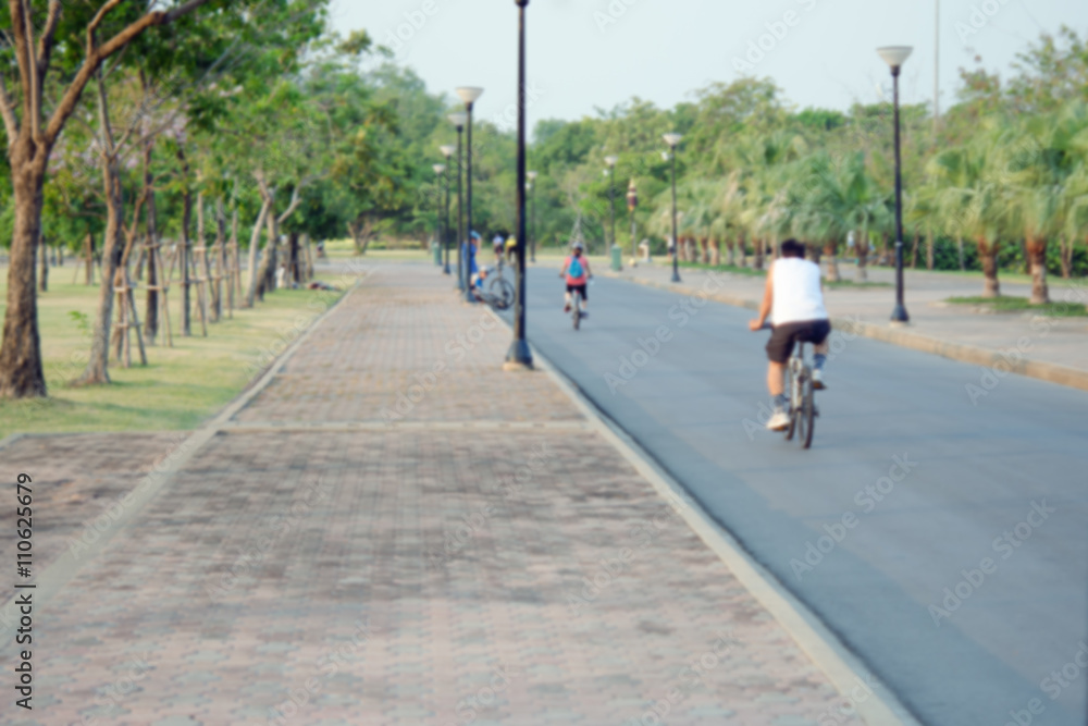 People relax in park and garden with blurred view