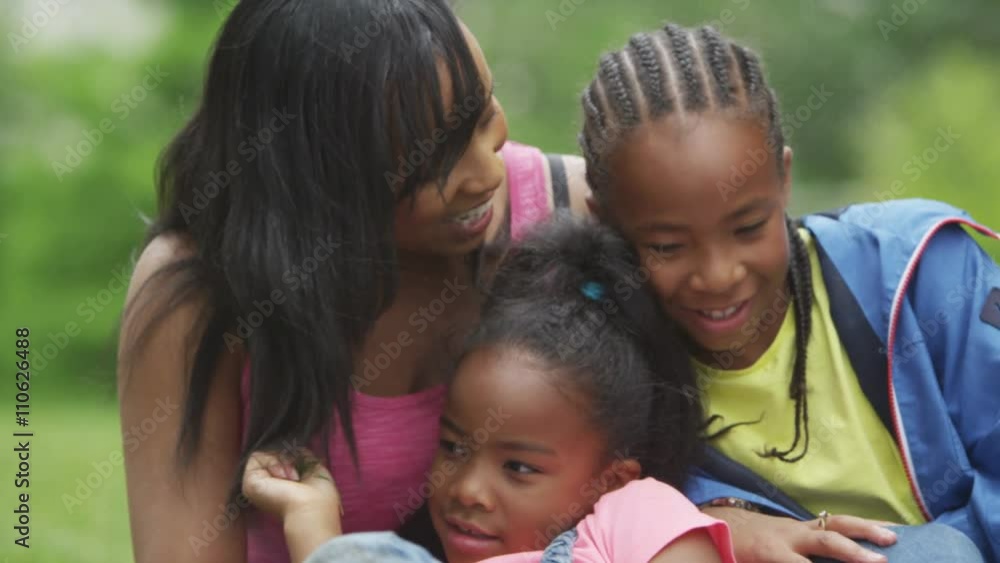 Portrait of happy African American mother & children having fun in the park. Portrait of happy African American mother & children having fun in the park.