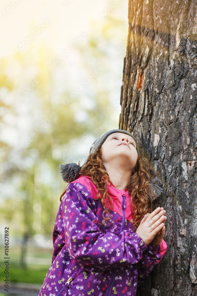 Praying little girl looking up. Praying little girl looking up.