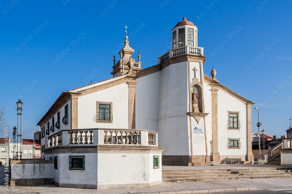 Nossa Senhora da Lapa church in Povoa de Varzim, Portugal. The place where the many local fishermen or families seek help in times of danger. It includes a lighthouse in the structure.