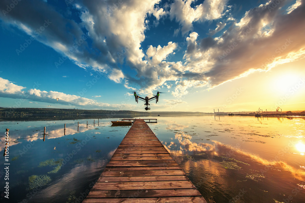 Image of drone over the lake, sunset shot - obrazy, fototapety, plakaty 