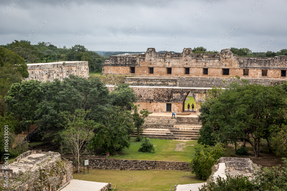 Uxmal, Mexico - January 12th 2014 Tourists enjoying a cloudy day at the Uxmal Ruins in Mexico.