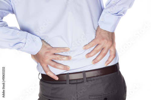 Back pain.

Young businessman suffering back pain.