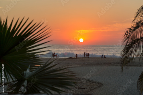 PUERTO ESCONDIDO, MEXICO - JANUARY 10TH 2014 - PEOPLE ENJOYING THE BEACH IN PUERTO ESCONDIDO, MEXICO