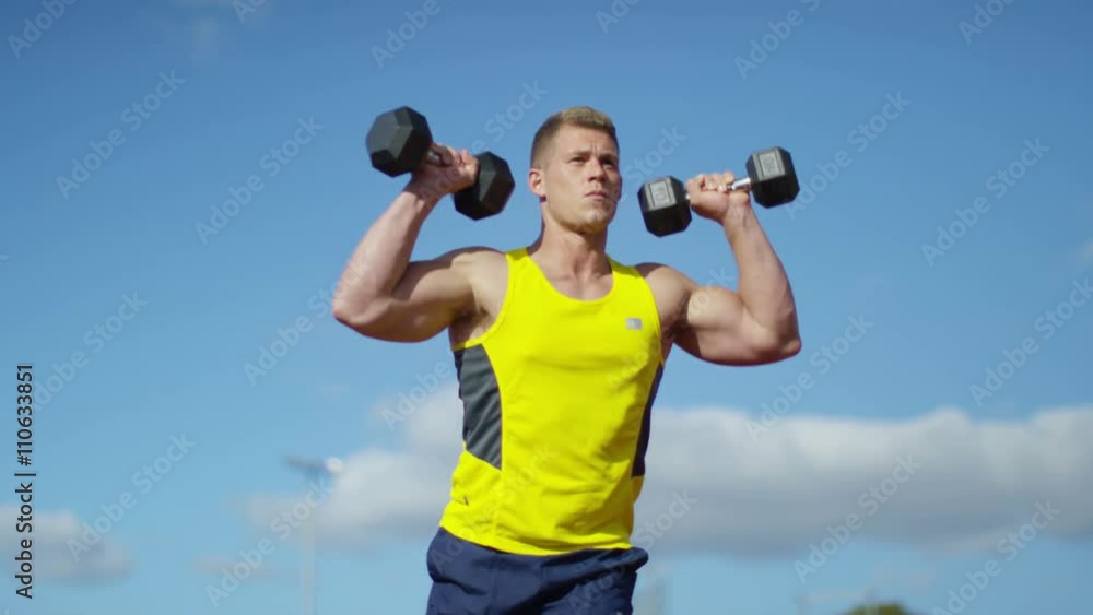 Disabled athlete with prosthetic leg working out with weights @ running track Disabled athlete with prosthetic leg working out with weights @ running track