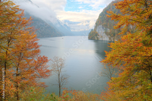 Fototapeta Naklejka Na Ścianę i Meble -  View of Koenigssee ( King's Lake) surrounded by alpine mountains from Malerwinkel viewpoint in colorful autumn season ~ Beautiful scenery of Bavarian countryside in Berchtesgaden Germany