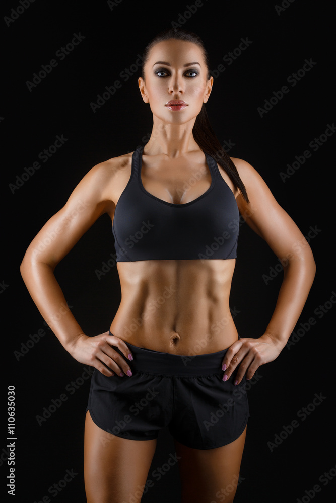 Fototapeta premium Sporty girl with muscles