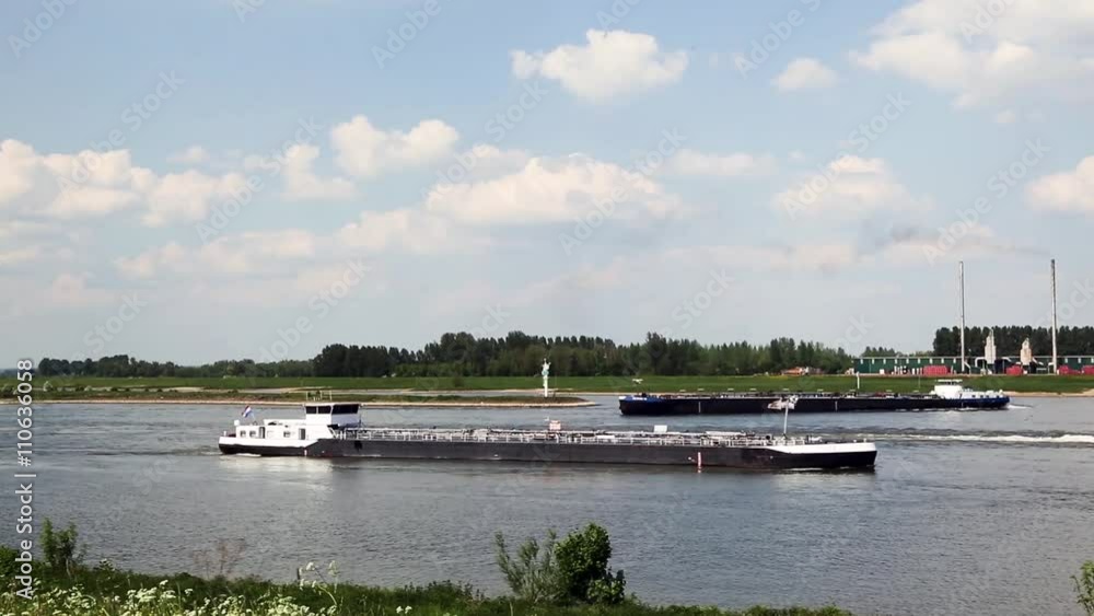 Tankers on Dutch river Waal, Millingen aan de Rijn, Gelderland, Netherlands Tankers on Dutch river Waal, Millingen aan de Rijn, Gelderland, Netherlands
