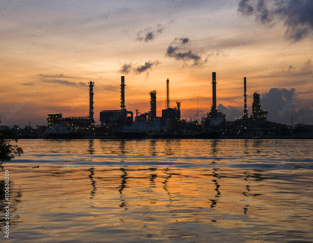 The energy refinery plant with water reflection 