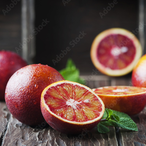 Red sweet oranges on the wooden table