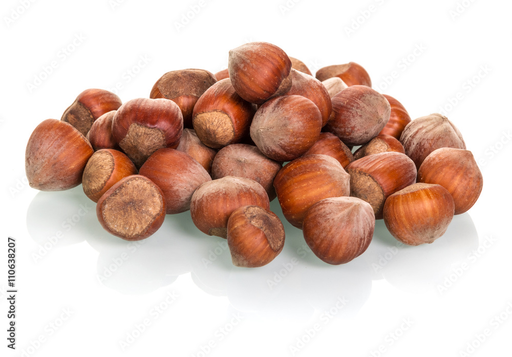 Pile of peeled hazelnuts isolated on white Pile of peeled hazelnuts isolated on white