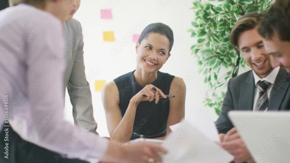 Confident business group in negotiation meeting shake hands on a deal Confident business group in negotiation meeting shake hands on a deal