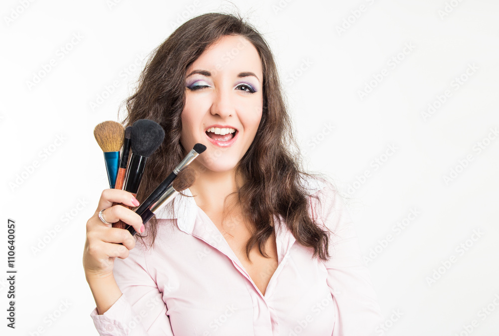Beautiful girl with set of brushes isolated on white background Beautiful girl with set of brushes isolated on white background