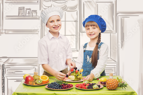 Children making fruit snacks