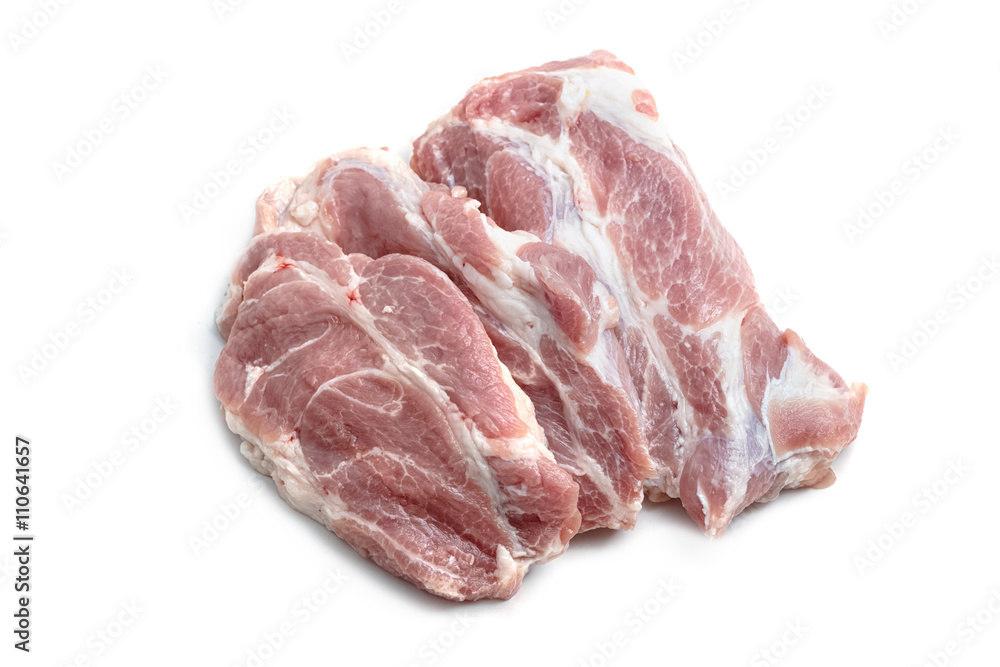 Raw pork meat steaks on the white background.