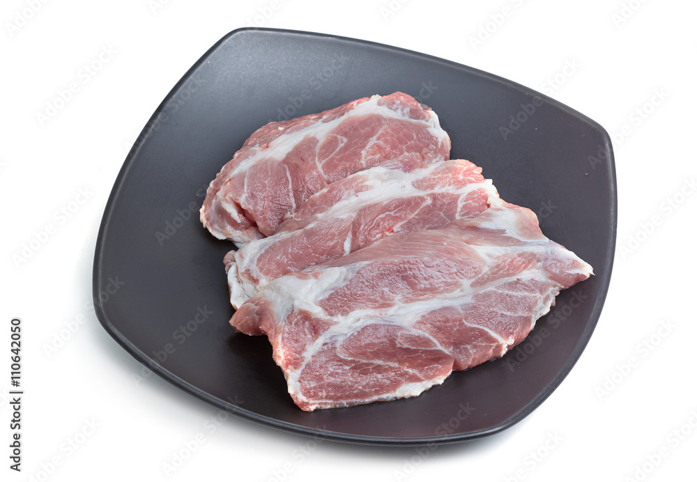 Raw pork meat steaks on the white background. Raw pork meat steaks on the white background.