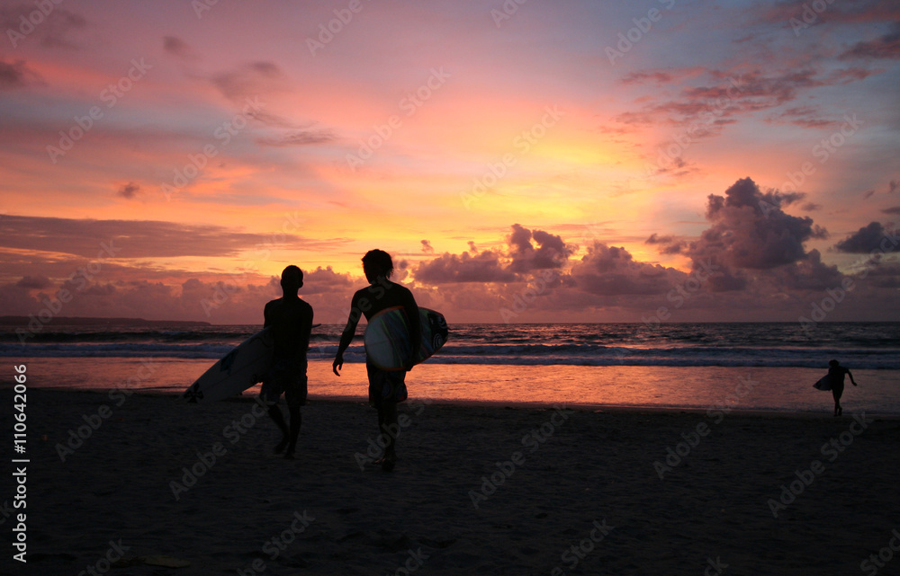 Sunset surfers in Kuta (Bali, Indonesia)
