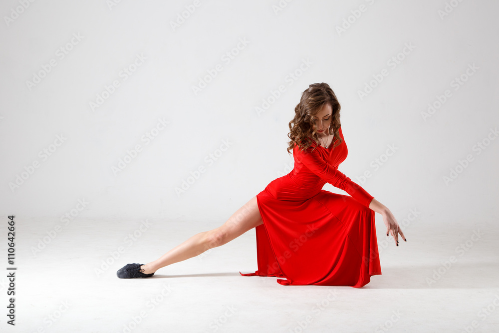 Dancing lady in a red dress. Contemporary modern dance on a white ...