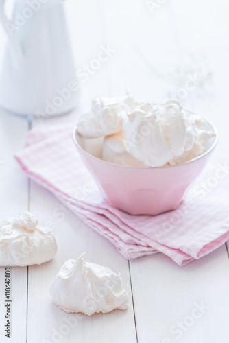 Meringue plate at white wooden background 