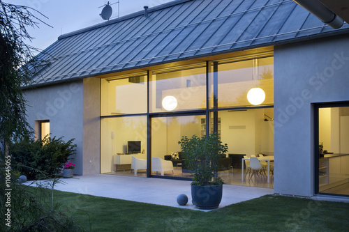 large family house at night with garden