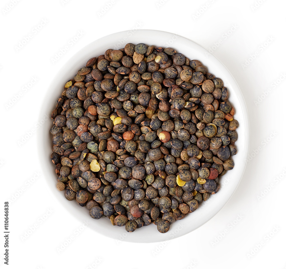Bowl of dry green lentil isolated on white, from above Bowl of dry green lentil isolated on white, from above