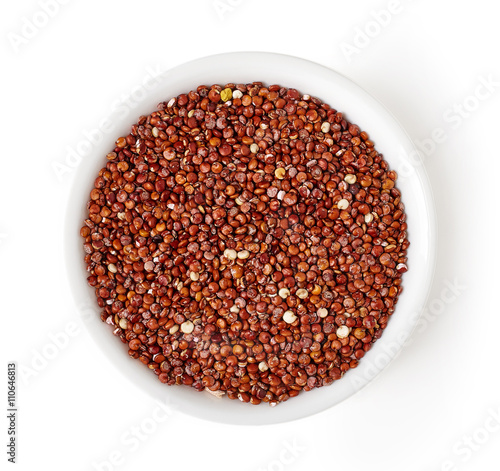 Bowl of red quinoa isolated on white, from above © bigacis