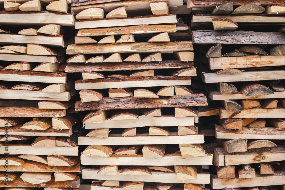 Splinters of logs stacked near the fence Splinters of logs stacked near the fence