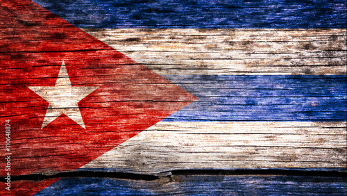 Cuba flag painted on the old cracked wood with worn-out paint. Grunge look.