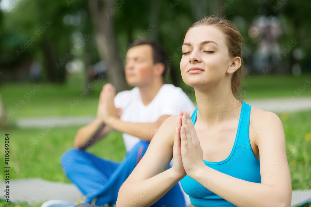 Having yoga practice in park