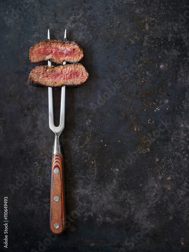 Steak on meat fork