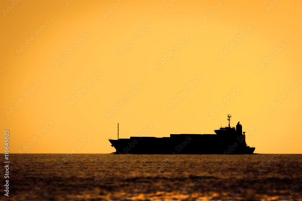 Silhouette of cruise ship at sunset in a sea Silhouette of cruise ship at sunset in a sea