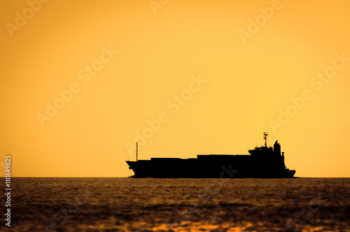 Silhouette of cruise ship at sunset in a sea