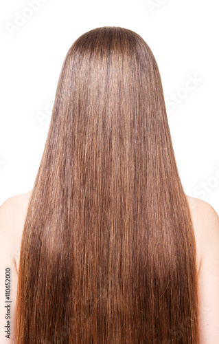 Woman with well-groomed, brown, long hair isolated on white 