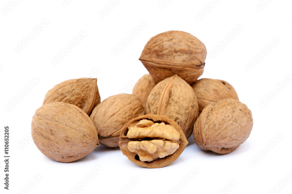 Fresh walnut with a shell isolated on white background Fresh walnut with a shell isolated on white background