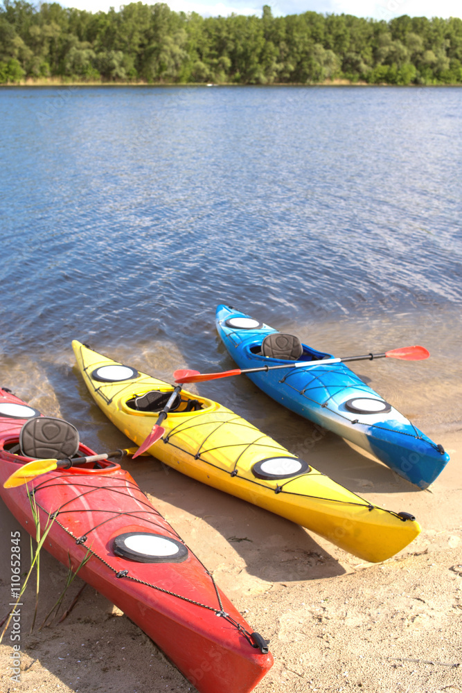 Camping with kayaks on the beach on a sunny day. Camping with kayaks on the beach on a sunny day.