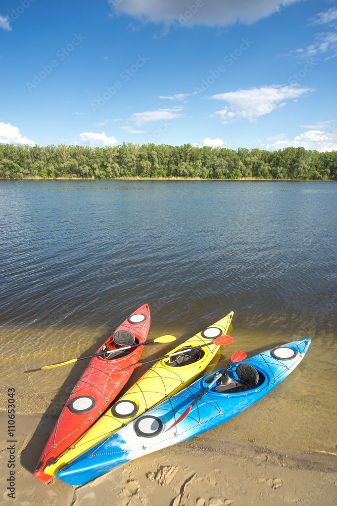 Camping with kayaks on the beach on a sunny day. Camping with kayaks on the beach on a sunny day.