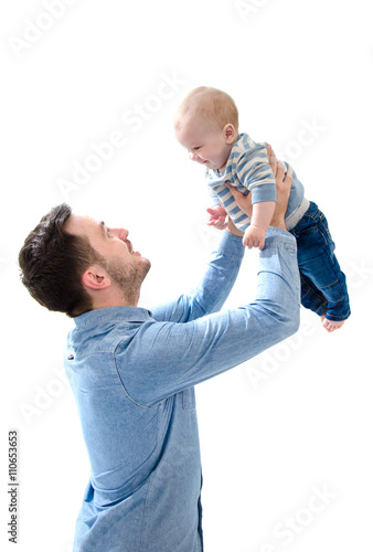 Father raise his new born baby boy on his hands on white backgro