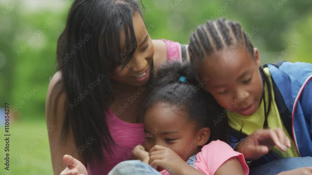 Portrait of happy African American mother & children having fun in the park. Portrait of happy African American mother & children having fun in the park.